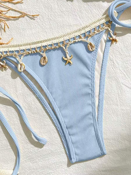 Light pink ribbed halterneck bikini with triangle cups and tie-side bottom, adorned with shell and starfish charms. - Image 15