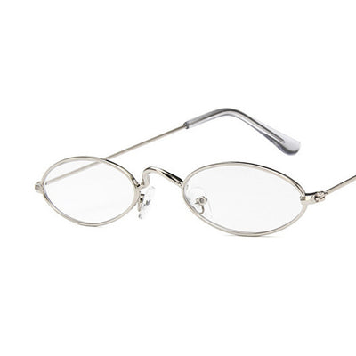 Retro oval frame sunglasses with vibrant red lenses and shiny gold-colored metal frames on a white background. - Image 10