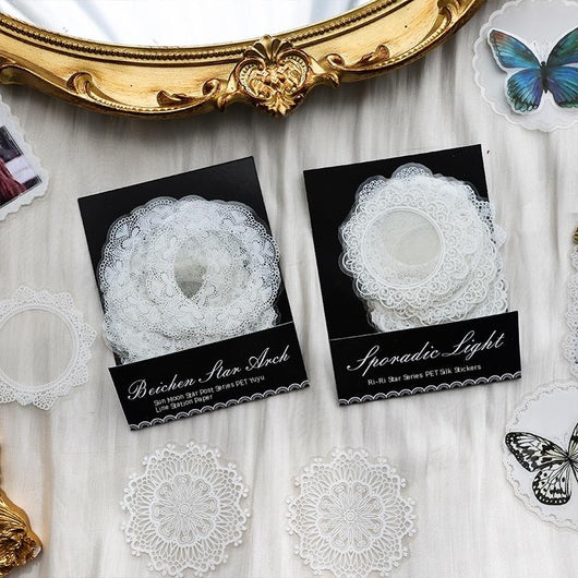Set of 15 white lace-patterned circular stickers with intricate designs, labeled "North Star Arch" and "30 sheets." - Image 9