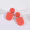 Aretes Geométricos Girasol en Relieve