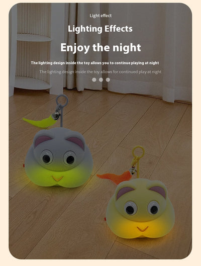 Gray pet toy shaped like a mouse or cat head with googly eyes, pink ears, and a yellow feather with a bell. - Image 14