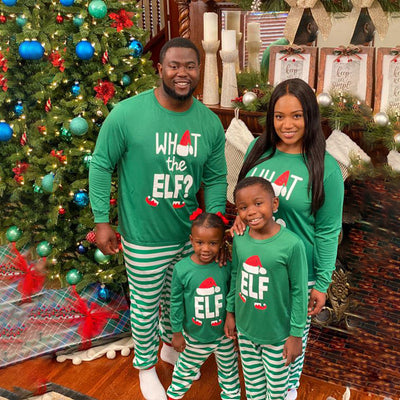 Family of four wearing matching green long-sleeve Christmas pajamas with "ELF" and striped pants. - Image 5