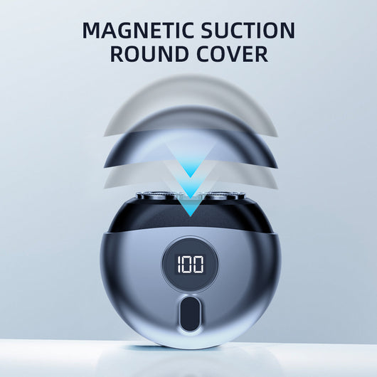 Dark gray mini electric razor with a circular design, featuring a small black display window and a silver trim. - Image 3