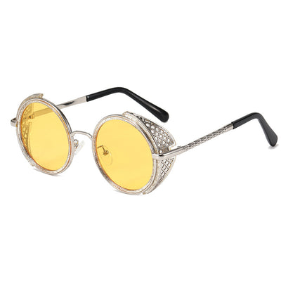 Round gold-framed sunglasses with light blue lenses and decorative side shields, featuring black temple tips. - Image 14