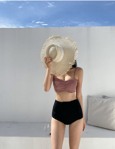 Women's retro high-waisted split bikini with a pink shirred bandeau top and black ruched bottoms. - Image 14