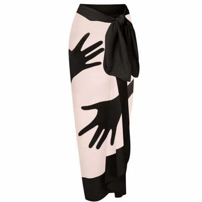 Women's light pink one-piece bikini with black handprint pattern and matching tie-waist sarong. - Image 5