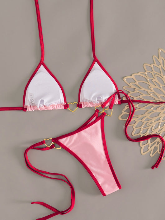 Pink and red halter-style triangle bikini with heart-shaped hardware and tie-up thong bottom, worn on a beach. - Image 20