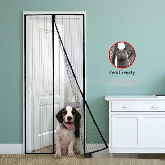 Black magnetic mosquito-proof curtain installed in a white doorway, with a puppy sitting in front of it.