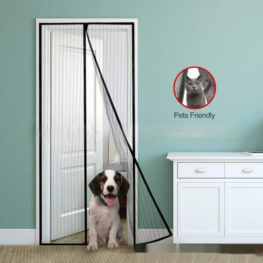 Black magnetic mosquito-proof curtain installed in a white doorway, with a puppy sitting in front of it.