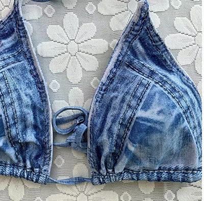 Women's light blue denim print two-piece bikini swimsuit with a halter neck top and tie-side bottoms, styled with a straw hat and sunglasses. - Image 18