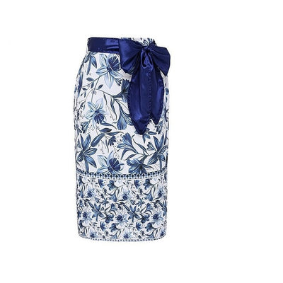 Women's blue and white floral one-piece swimsuit with ruffled V-neck and matching sarong skirt with bow. - Image 9