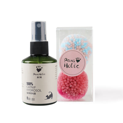 Two fluffy cat pom-pom toys, one pink and blue, one pink, in a clear box with a small bottle of catnip hydrosol. - Image 15