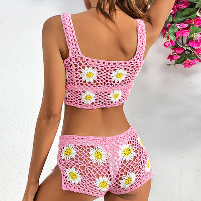 Pink crochet two-piece swimsuit with white and yellow daisy patterns, featuring a crop top and matching shorts. - Image 9