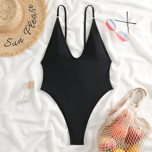 Dark brown one-piece swimsuit with a deep V-neckline and thin adjustable straps, styled with a straw hat and sunglasses. - Image 6