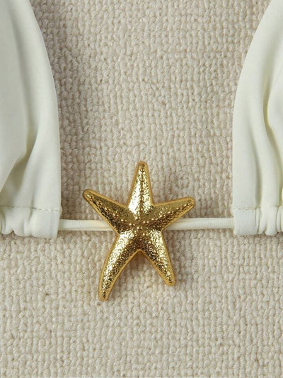 White women's bikini with triangle top and tie-side bottom, featuring a gold starfish charm on the center front. - Image 33