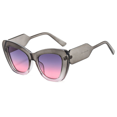 Pink cat-eye sunglasses with green temples and brown to pink gradient lenses on a white background. - Image 9