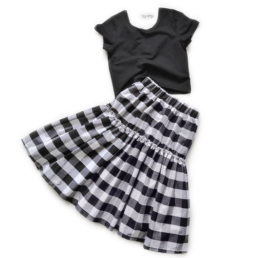 Matching black and white gingham two-piece outfits, one adult and one child size, with black short-sleeve tops and tiered skirts. - Image 11
