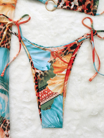 Leopard print and hibiscus floral bikini set with sheer maxi cover-up dress in red, orange, blue, and green. - Image 9