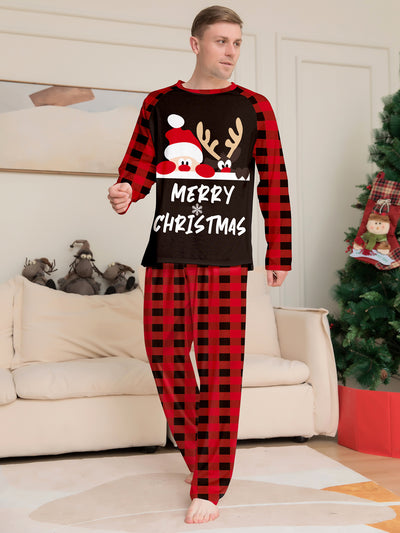 Family of four wearing matching red and black buffalo plaid Christmas pajamas with reindeer graphic. - Image 10