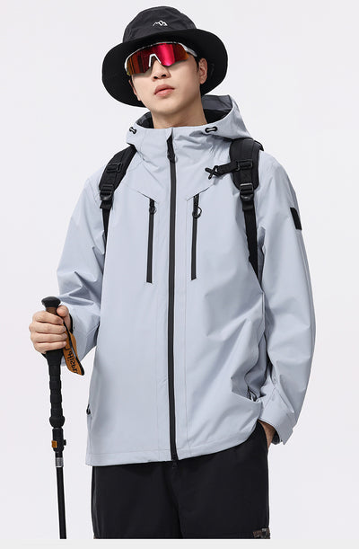 Man wearing a black windproof and waterproof outdoor jacket with a hood, sports sunglasses, and a bucket hat, holding a trekking pole. - Image 19