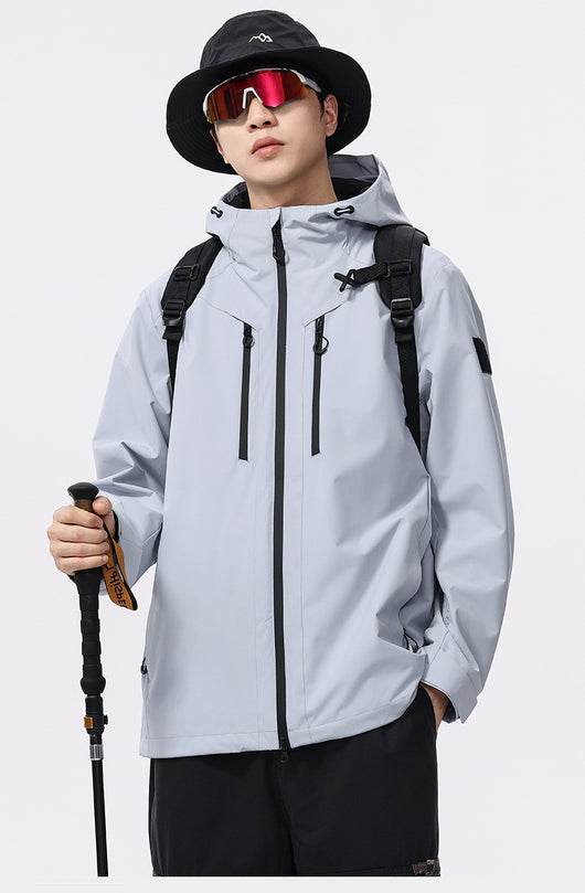 Man wearing a black windproof and waterproof outdoor jacket with a hood, sports sunglasses, and a bucket hat, holding a trekking pole. - Image 19