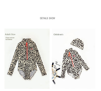Child's long-sleeve leopard print swimsuit with a coral zipper and a matching swim cap on a white background. - Image 12