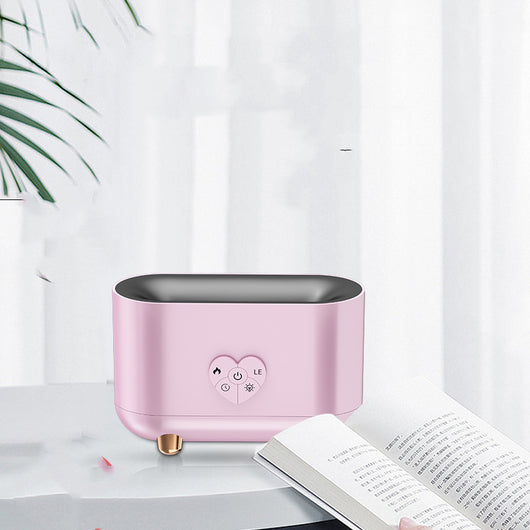 Black flame effect humidifier with a heart-shaped control panel, featuring power, timer, and light functions, on rose gold feet. - Image 10