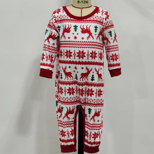 White long-sleeved pajama set with red and green Fair Isle Christmas pattern featuring reindeer and trees.