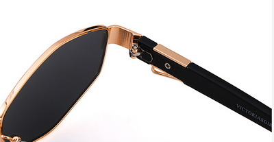 Women's hexagonal sunglasses with dark lenses, gold-colored metal frame, black temples, and a detachable gold chain. - Image 23