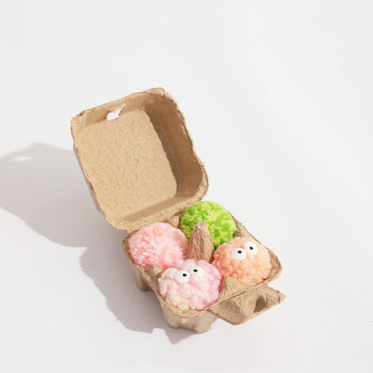 Assortment of soft, colorful yarn ball dog toys with built-in bells, featuring various patterns and textures. - Image 9
