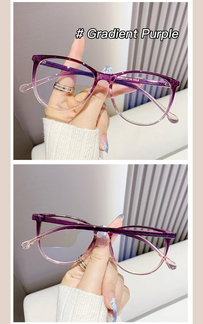 Black full-frame round anti-blue light glasses held by a hand with a gold ring and light blue gradient nails. - Image 14