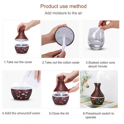 Dark wood grain humidifier shaped like a vase, with glowing green animal cutouts and mist emitting from the top. - Image 12