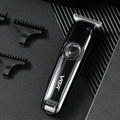 Black VGR rechargeable hair trimmer with silver blade, USB charging cable, cleaning brush, oil, and three guide combs (1mm, 2mm, 3mm).