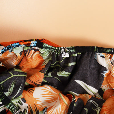 Family matching Hawaiian outfits: men's shirt and shorts, women's off-shoulder maxi dress, girl's dress, boy's shirt and shorts, all with black, orange hibiscus - Image 12