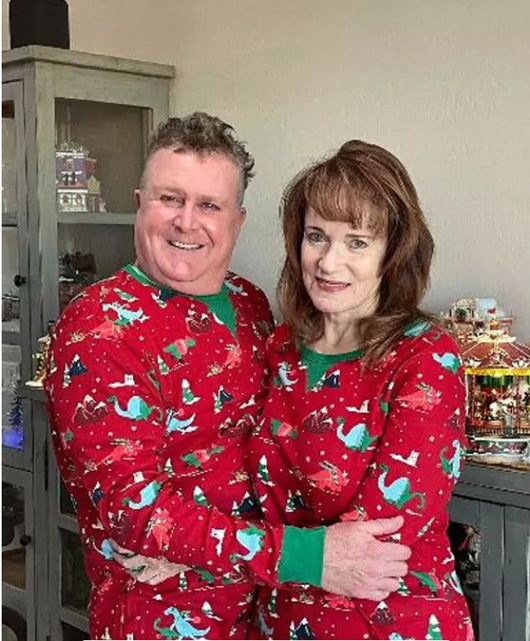 Red long-sleeved men's pajama set with a festive dinosaur and Christmas tree print, featuring green cuffs. - Image 14