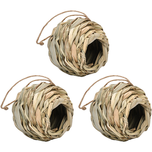 Three spherical bird nests made from woven straw or grass, each with a round opening and a jute hanging loop.