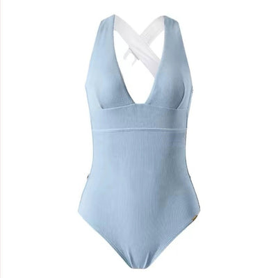 Light blue ribbed one-piece swimsuit with a deep V-neck and halter straps, modeled on a person. - Image 5