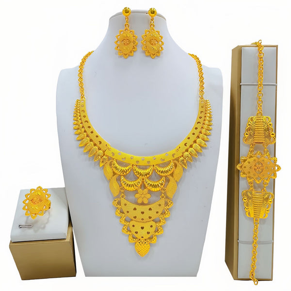 Gold-colored women's jewelry set with ornate floral and filigree designs, including a necklace, drop earrings, bracelet, and ring.