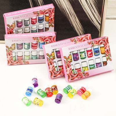 A 12-piece essential oil set in a decorative pink box with a rose floral design. Includes scents like Lavender, Rose, Lemon, and Green Tea. - Image 8