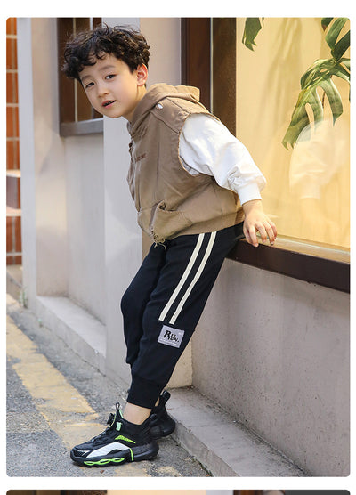 Black, white, and neon green children's basketball shoes with rotating buckle closure, featuring a mid-top design. - Image 31