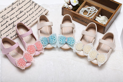 Beige girls' princess shoes with pearl and rhinestone bows, featuring a flat heel and a convenient Velcro strap. - Image 26