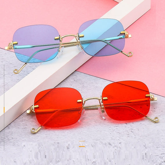 Frameless square sunglasses featuring vibrant blue lenses and sleek gold-colored metal temples and bridge.