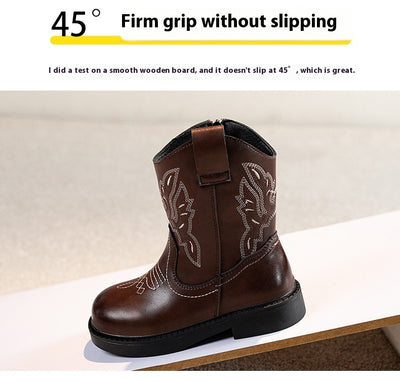 Girls' brown Martin boots with white ethnic embroidery, side zippers, and black soles, displayed on a light carpet. - Image 12