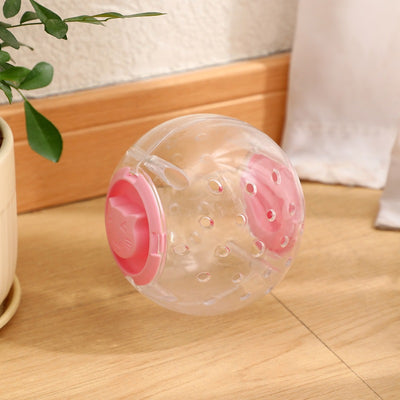 Clear plastic pet tumbler food leakage toy with blue accents and a cat face design, on a wooden floor. - Image 7