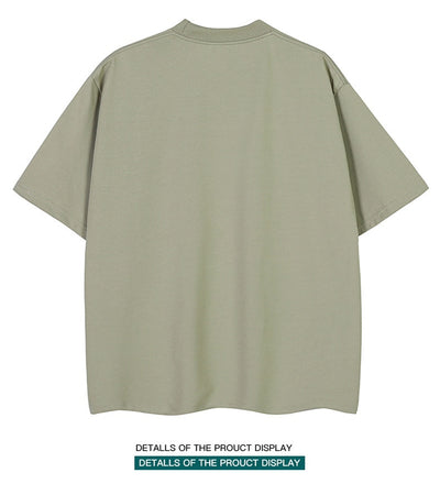 Moss green short-sleeve cotton t-shirt with a crew neck and a relaxed, oversized fit. - Image 15