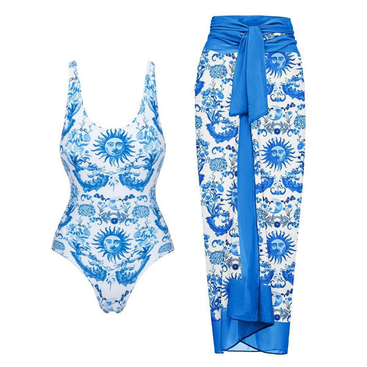 White one-piece swimsuit with a blue sun and intricate floral pattern, featuring a scoop neck and wide straps. - Image 7