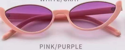 Pink cat-eye sunglasses with purple gradient lenses on a white background, showcasing a trendy style. - Image 12