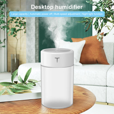 White and clear cylindrical mini humidifier with a 'T' logo, featuring a top mist outlet and transparent water tank. - Image 6