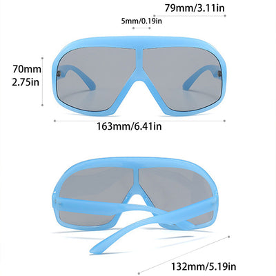 Oversized women's shield sunglasses with a tortoiseshell frame and brown-tinted lenses, held by a hand. - Image 8