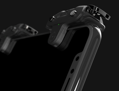 Black F5 game controller for mobile phones with two silver trigger buttons and a green indicator light. - Image 12
